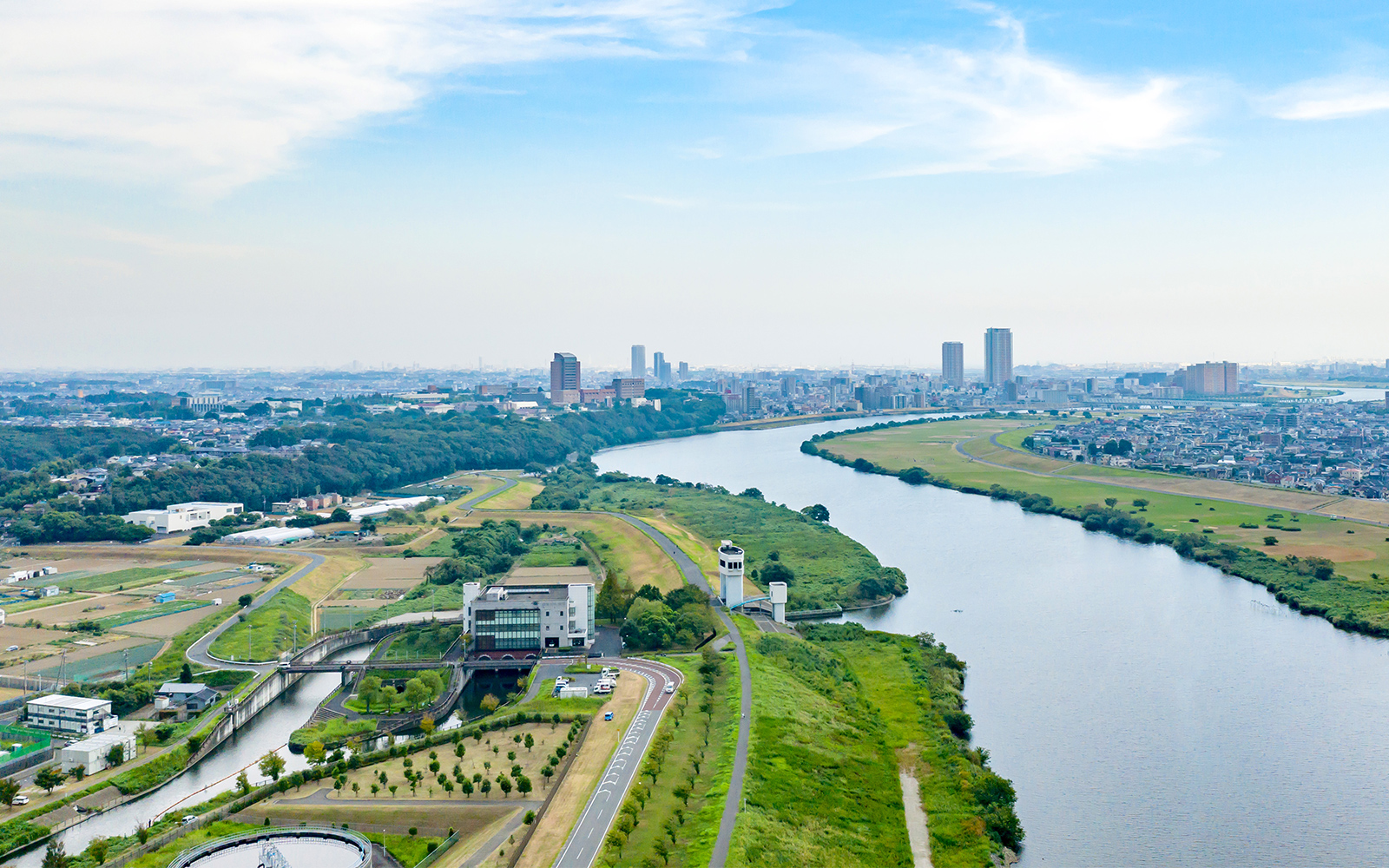 A river leading to a city view in the background