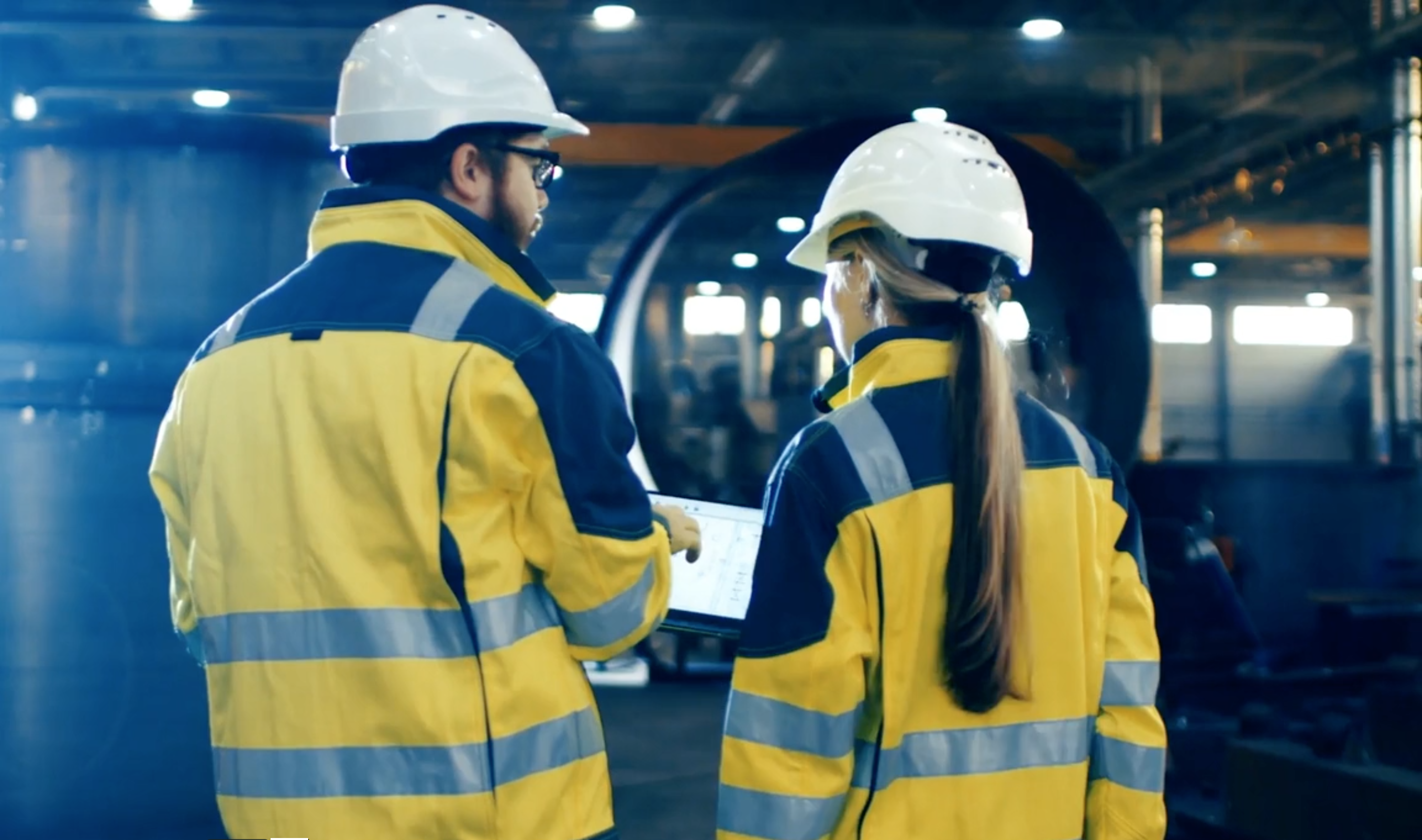 Two people conducting a health and safety assessment.