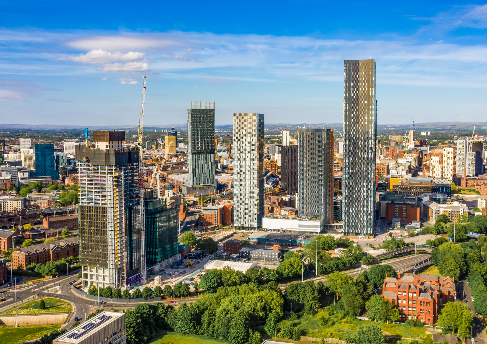 Landscape of tall buildings under construction in the city of Manchester