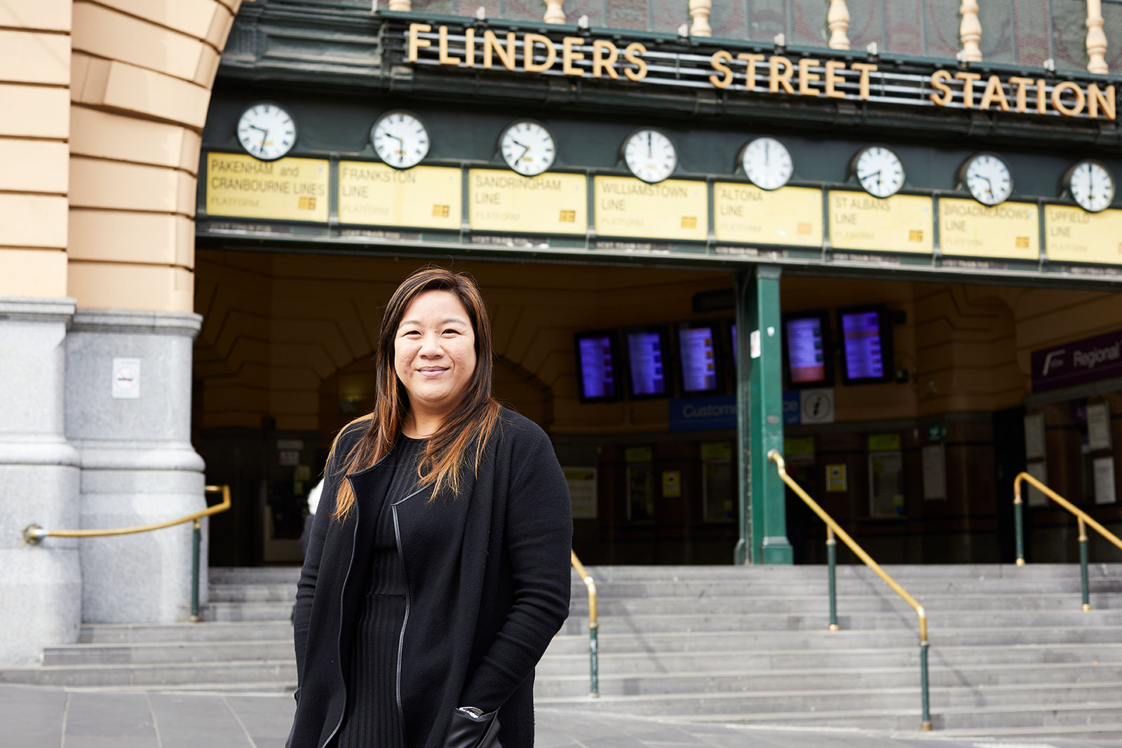 Jessica Ho, RPS Project Manager is standing out front of Flinders Street Train Station in Melbourne CBD.