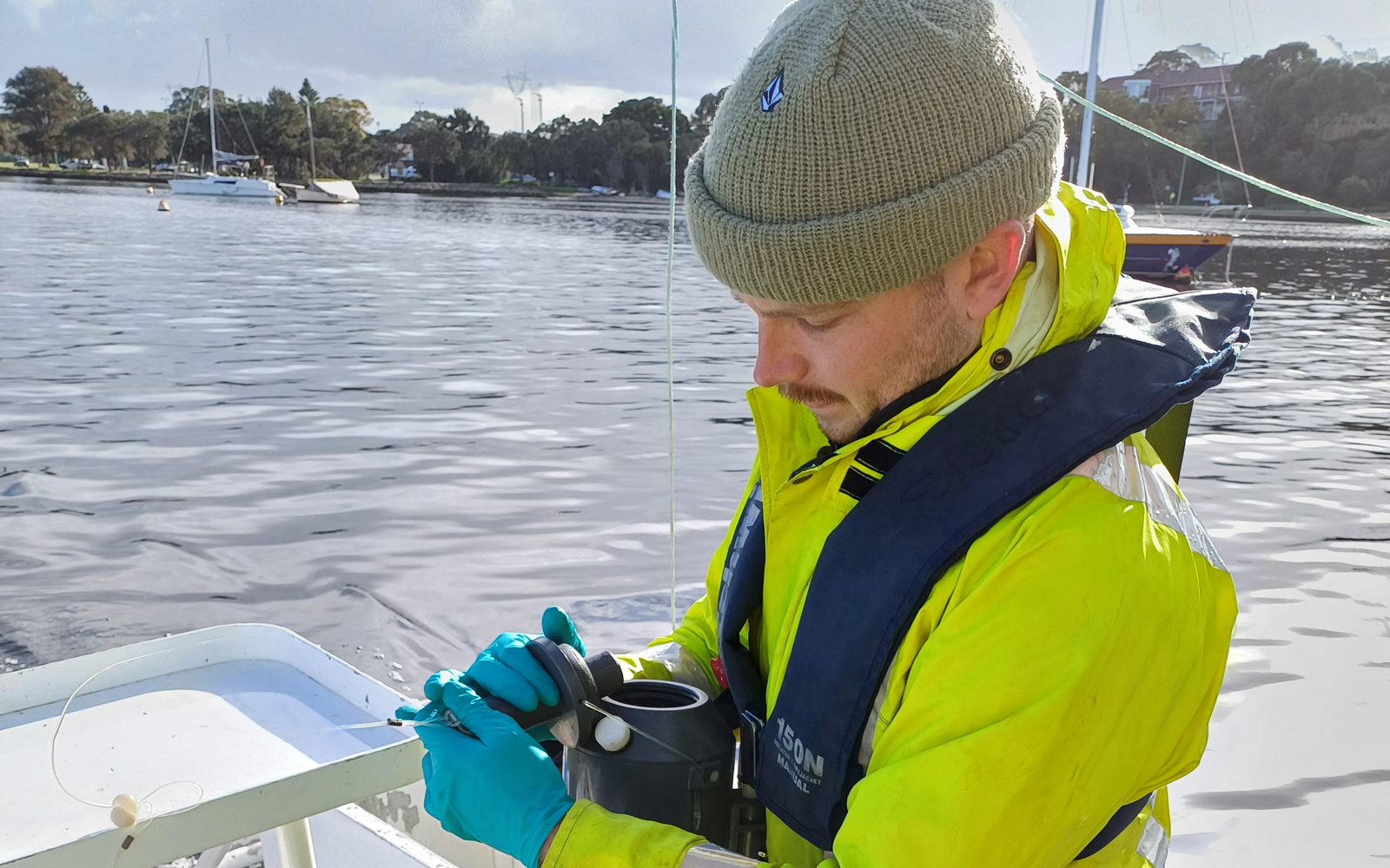 RPS Scientist Ciaran Carolan sampling on the Swan River, Perth