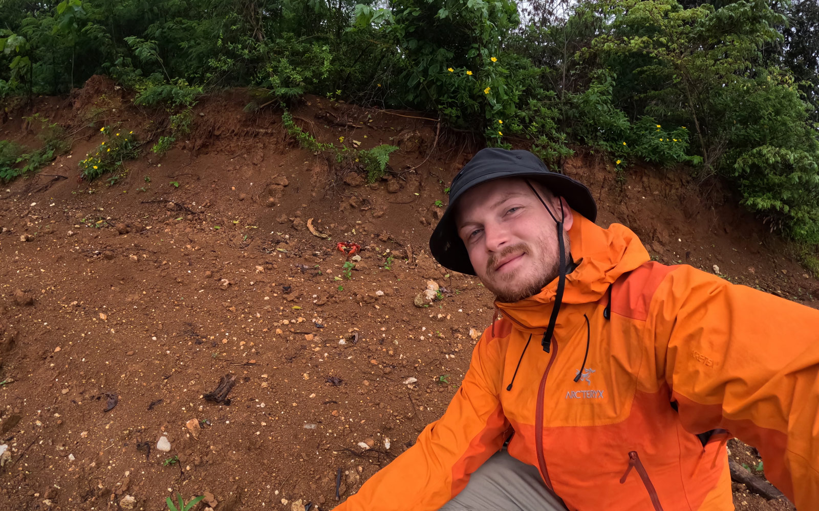 RPS scientist Ciaran Carolan gets up close with a red crab on Christmas Island, during their yearly migration 