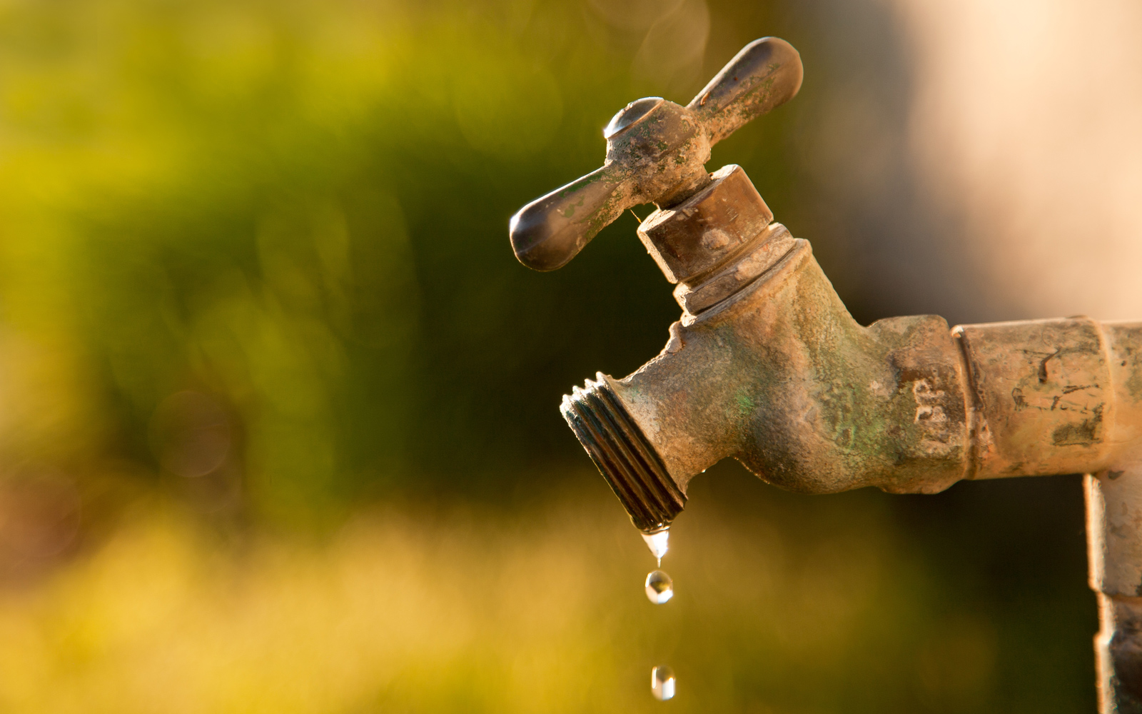 Water drips from a tap